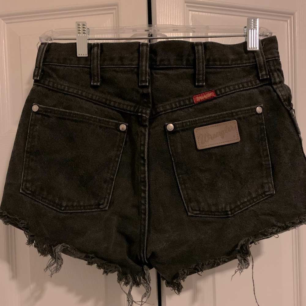 The perfect distressed Wrangler cutoffs. Measures 14.5” across & 10” Rise